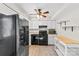 A kitchen featuring white cabinets and black appliances at 1228 Archdale Dr # H, Charlotte, NC 28217
