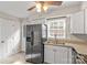 A kitchen featuring white cabinets, granite countertops, and stainless steel appliances at 1228 Archdale Dr # H, Charlotte, NC 28217