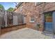 Cozy patio featuring a dartboard, string lights, and access to the home's interior at 1228 Archdale Dr # H, Charlotte, NC 28217