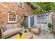 Cozy patio with comfortable seating and string lights at 1228 Archdale Dr # H, Charlotte, NC 28217