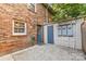 Enclosed patio with a storage building and access to a hose at 1228 Archdale Dr # H, Charlotte, NC 28217