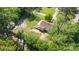 Expansive lot featuring a cozy single-Gathering home with a screened in porch surrounded by lush greenery at 1302 N Ellis St, Salisbury, NC 28144
