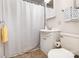 Functional bathroom with white fixtures, a shower, and tiled floor, providing essential comfort and convenience at 1302 N Ellis St, Salisbury, NC 28144
