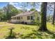 Charming single-story home with a screened porch and a well-maintained yard, exuding a cozy and inviting ambiance at 1302 N Ellis St, Salisbury, NC 28144