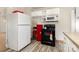 Cozy kitchen featuring white appliances and cabinets, with ample counter space for meal preparation at 1302 N Ellis St, Salisbury, NC 28144