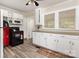 Efficient kitchen with white cabinets and modern appliances, ideal for cooking and entertaining at 1302 N Ellis St, Salisbury, NC 28144