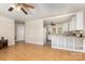 Open-concept living space seamlessly connects to a kitchen with white cabinets and ample counter space at 1302 N Ellis St, Salisbury, NC 28144