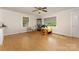 Bright living room featuring hardwood floors, neutral walls, and abundant natural light through large windows at 1302 N Ellis St, Salisbury, NC 28144