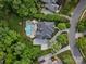 Beautiful aerial view highlighting mature trees, sparkling pool, private backyard, and lush landscape at 13029 Whisper Creek Dr, Charlotte, NC 28277