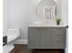 Stylish bathroom featuring a modern vanity and round mirror with gold accents at 13029 Whisper Creek Dr, Charlotte, NC 28277