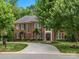 Charming brick home featuring a well-manicured lawn, elegant front entrance and an inviting curb appeal at 13029 Whisper Creek Dr, Charlotte, NC 28277