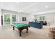 Large game room with pool table and ample seating at 13029 Whisper Creek Dr, Charlotte, NC 28277