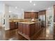 Beautiful kitchen with a center island, granite countertops, and stainless steel appliances at 13029 Whisper Creek Dr, Charlotte, NC 28277
