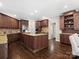 Spacious kitchen featuring granite countertops, custom cabinetry, and stainless steel appliances at 13029 Whisper Creek Dr, Charlotte, NC 28277