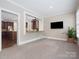 Cozy living room featuring a passthrough to the kitchen and neutral colors at 13029 Whisper Creek Dr, Charlotte, NC 28277