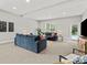 Spacious living room with comfortable seating and natural light at 13029 Whisper Creek Dr, Charlotte, NC 28277
