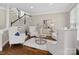 Cozy living room with a staircase, neutral tones, and recessed lighting at 13029 Whisper Creek Dr, Charlotte, NC 28277