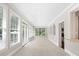 Bright sunroom featuring lots of natural light and neutral colors at 13029 Whisper Creek Dr, Charlotte, NC 28277