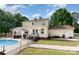 Exterior backyard showcasing a deck, pool with fence, and a covered outdoor seating area at 131 Scotland Dr, Mooresville, NC 28115