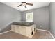 Bedroom with gray walls, carpeted floors, ceiling fan, and built-in platform bed and storage at 131 Scotland Dr, Mooresville, NC 28115