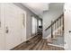 Welcoming foyer with hardwood floors, a staircase, and a view into an office space at 131 Scotland Dr, Mooresville, NC 28115