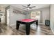 Game room featuring a red felt pool table, hardwood floors, ceiling fan, and trophy shelf at 131 Scotland Dr, Mooresville, NC 28115