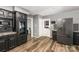 Open kitchen with a large refrigerator, built-in microwave, and views of a built-in wine cooler at 131 Scotland Dr, Mooresville, NC 28115