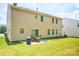 View of the backyard with a patio, lawn, and home's siding at 14837 Dungannon Ct, Charlotte, NC 28278
