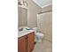 Bathroom featuring a single sink vanity with toilet, large mirror, neutral walls, and shower with white curtain at 14837 Dungannon Ct, Charlotte, NC 28278