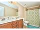 Bathroom with a double vanity, tile flooring, and a colorful shower curtain at 14837 Dungannon Ct, Charlotte, NC 28278