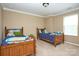 Shared bedroom featuring two beds and plenty of natural light at 14837 Dungannon Ct, Charlotte, NC 28278
