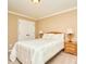 Bedroom featuring neutral walls and carpet, as well as a comfortable bed and nightstands at 14837 Dungannon Ct, Charlotte, NC 28278