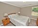 Bedroom with beige walls, carpet flooring, a double bed with lamps and a window at 14837 Dungannon Ct, Charlotte, NC 28278