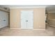 Bedroom with double doors, neutral walls and carpet, and ample closet space at 14837 Dungannon Ct, Charlotte, NC 28278