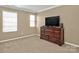 This room features a dresser and large windows providing ample natural light at 14837 Dungannon Ct, Charlotte, NC 28278