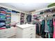 Walk-in closet with custom shelving and storage solutions for clothing and accessories at 14837 Dungannon Ct, Charlotte, NC 28278