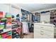 Walk-in closet with custom shelving and storage solutions for clothing and accessories at 14837 Dungannon Ct, Charlotte, NC 28278