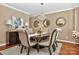 Formal dining area with elegant lighting, stylish decor, and hardwood flooring at 14837 Dungannon Ct, Charlotte, NC 28278