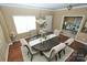 Elegant dining room featuring a round dining table and a decorative chandelier at 14837 Dungannon Ct, Charlotte, NC 28278