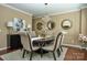 Elegant dining room featuring a chandelier, dark wood table, and sophisticated decor at 14837 Dungannon Ct, Charlotte, NC 28278