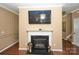 Cozy fireplace with a white mantel and decorative lanterns at 14837 Dungannon Ct, Charlotte, NC 28278