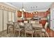 Open kitchen with dining area features stainless appliances and wood cabinetry at 14837 Dungannon Ct, Charlotte, NC 28278