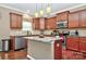 Modern kitchen with an island, stainless steel appliances, and sleek cabinetry at 14837 Dungannon Ct, Charlotte, NC 28278