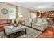 Inviting living room with hardwood floors, neutral paint, and comfortable seating arrangement at 14837 Dungannon Ct, Charlotte, NC 28278