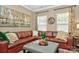 Comfortable living area features a leather sectional and decorative accents at 14837 Dungannon Ct, Charlotte, NC 28278