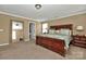 Spacious bedroom with a decorative mirror, ensuite bathroom, and ample natural light at 14837 Dungannon Ct, Charlotte, NC 28278