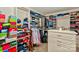 Walk-in closet with custom shelving and ample storage space for clothes, shoes, and accessories at 14837 Dungannon Ct, Charlotte, NC 28278
