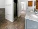 Bathroom featuring tiled floor, shower with glass door, and double vanity at 1507 Chadmore Nw Ln, Concord, NC 28027