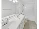 Bathroom featuring a double vanity, tiled floor, and shower/tub combo at 1507 Chadmore Nw Ln, Concord, NC 28027