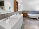 Elegant bathroom with double vanity, marble countertops, and a soaking tub at 1507 Chadmore Nw Ln, Concord, NC 28027